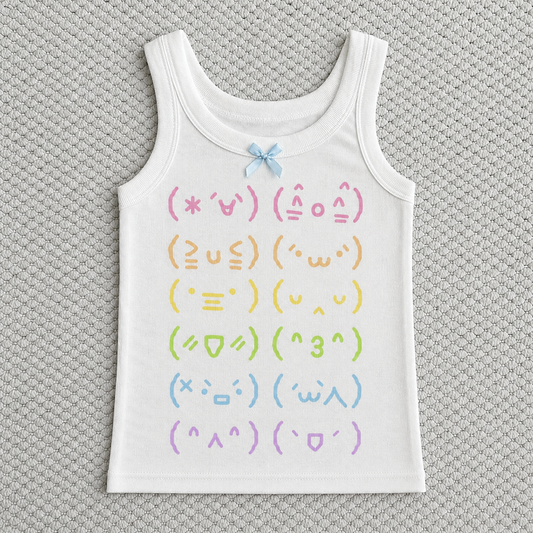 Flat lay of the Moody Kaomoji Tank on top of white carpet.