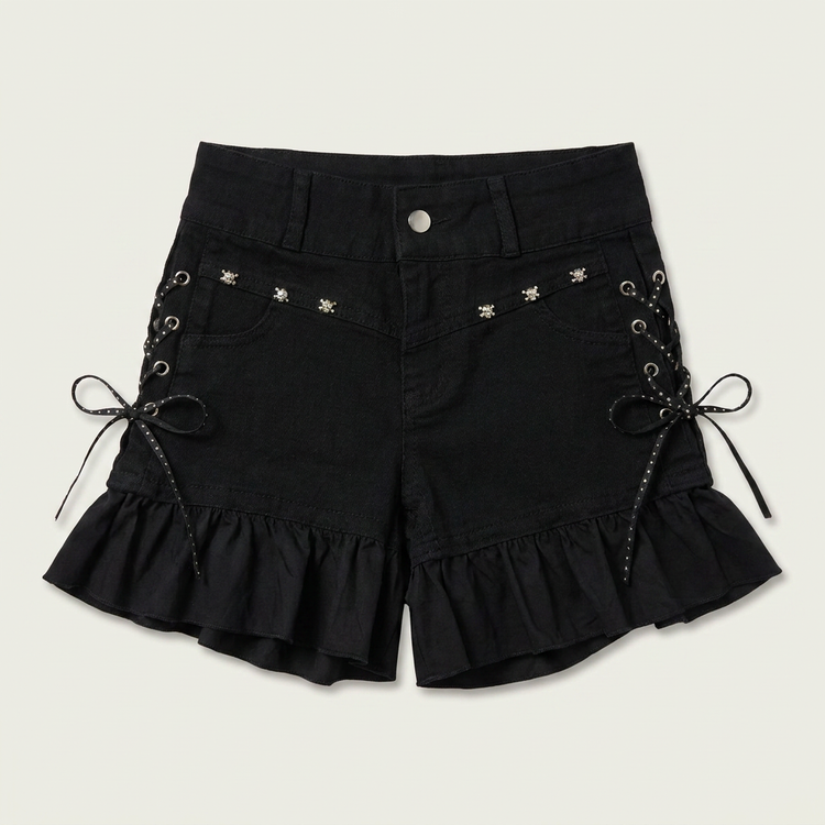 Two Moody Originals: Pretty Dangerous Shorts in black denim with custom ruffle hems, skull embellishments, and studded ribbon side lacing.