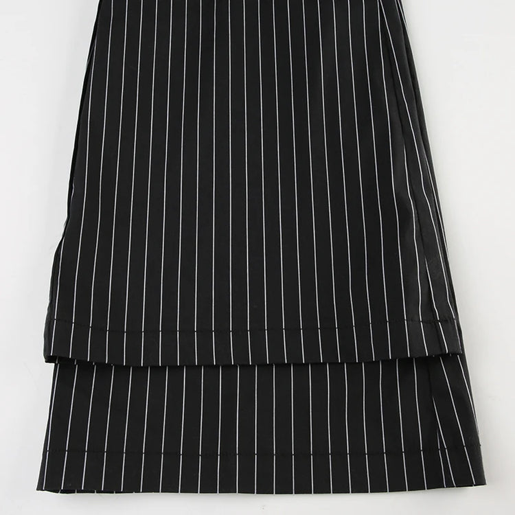 Overlapping view of pant hems from Y2K Business Chic Trousers, emphasizing clean tailoring and stripe alignment.