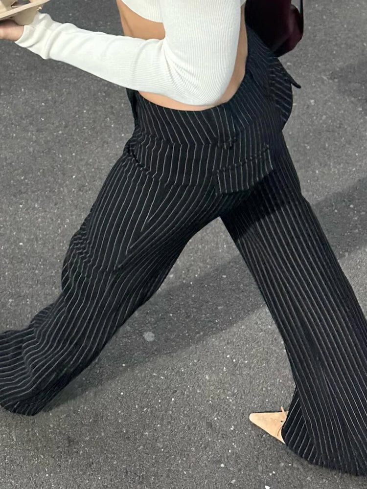 Back angle of model wearing Y2K Business Chic Trousers with streetwear styling and flattering pinstripe cut.