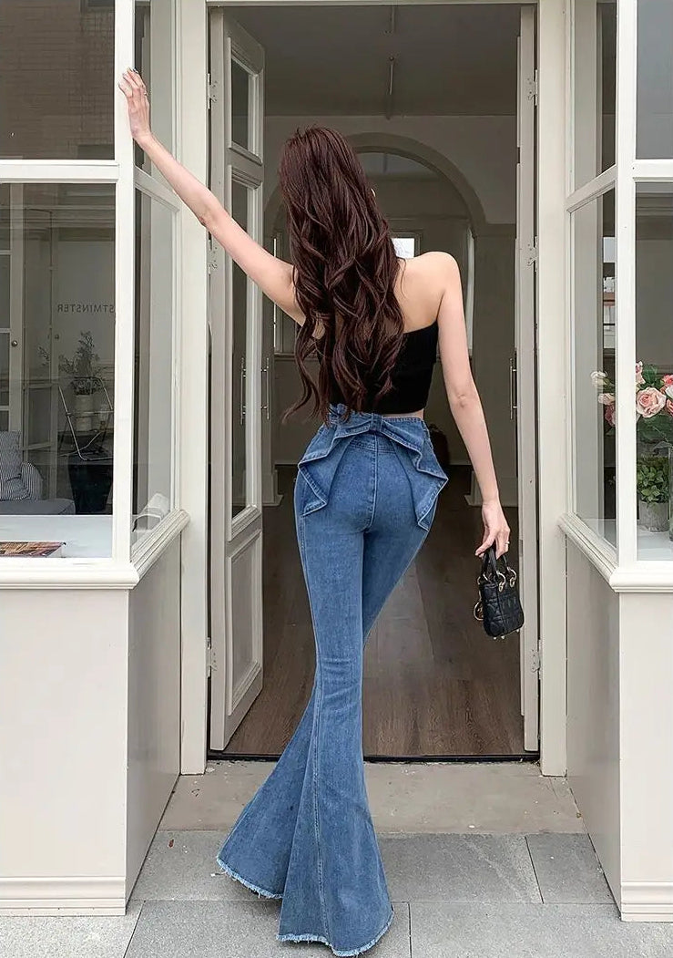 Full back view of the Dark Blue Backstage Bow Flare Jeans showcasing the bow detail.