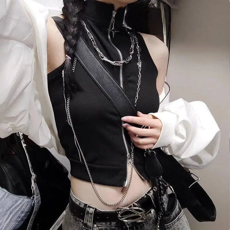 Model styling the Blackout Zip Top with a crossbody bag, showcasing the mock neckline, ribbed fabric, and cropped silhouette.