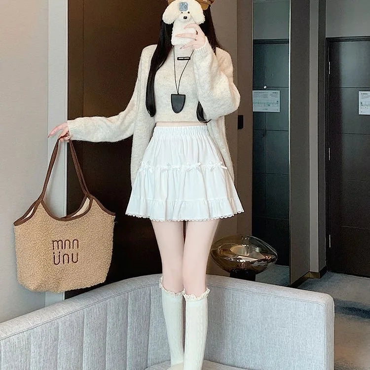 Front view of a model wearing the Bow Peep Mini Skort in White.