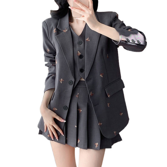 Model wearing full Butterfly Dreams Embroidered Suit with coat, vest, and skirt from front view