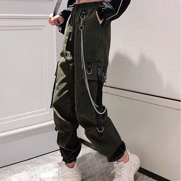 Side angle of model wearing army green Chain Reaction Cargo Joggers showing flap pocket and hanging chain