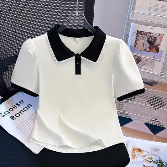 Front view of the Collar Me Cute Polo Top in white with black collar