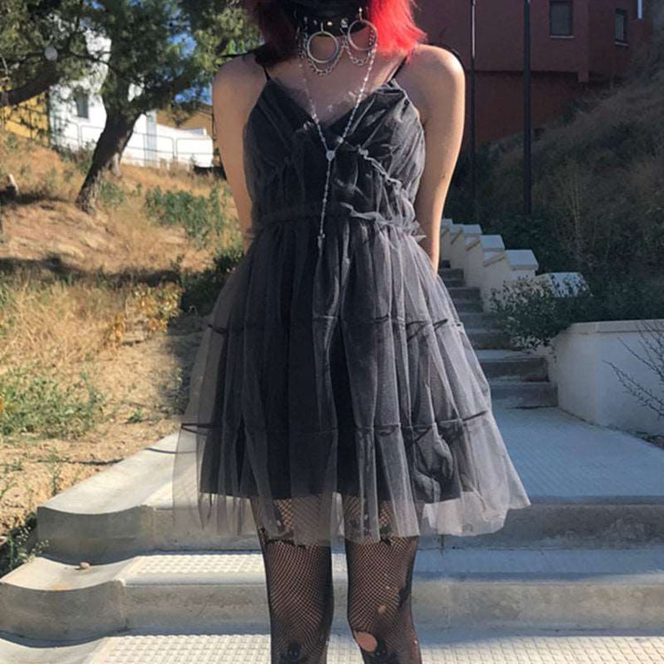 Closer view of model wearing Dark Fairy Tulle Dress outdoors in front-facing standing pose