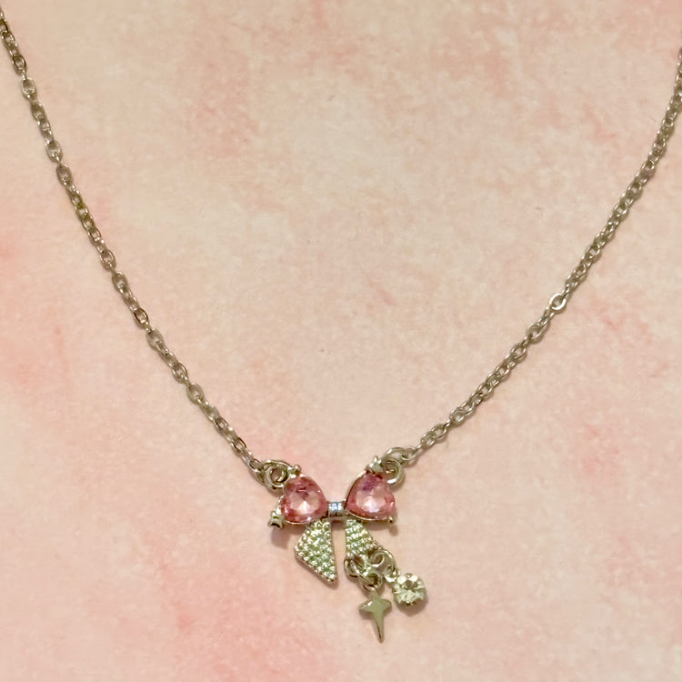 Detail shot of Daydream Bow Necklace chain and pendant connection