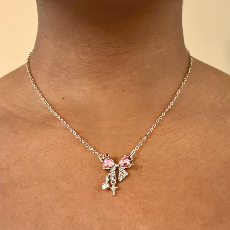 Daydream Bow Necklace worn on neck, showing size and fit of bow pendant