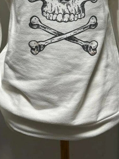 Bottom half front view of Dead Cute Off-Shoulder Top showing oversized fit and lower half of grunge skull print