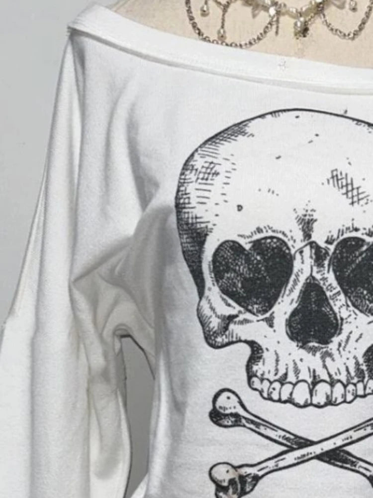 Detail view of skewed off-shoulder neckline and fabric texture on Dead Cute Off-Shoulder Top