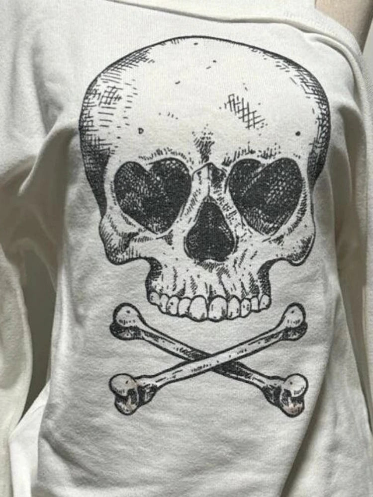 Close-up of bold skull and crossbones graphic on Dead Cute Off-Shoulder Top
