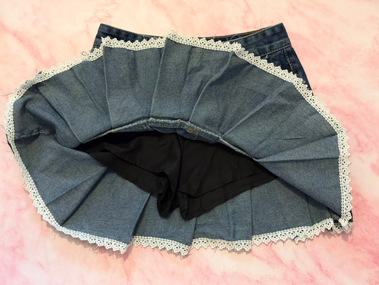 Inside view showing built-in shorts and lace trim of the Denim Daydream Pleated Lace Skort