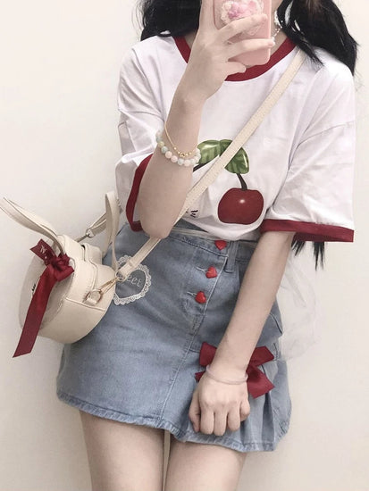 Styled with a cherry tee, the Dual Darling Denim Skirt shows off its embroidered heart patch and playful heart-shaped buttons