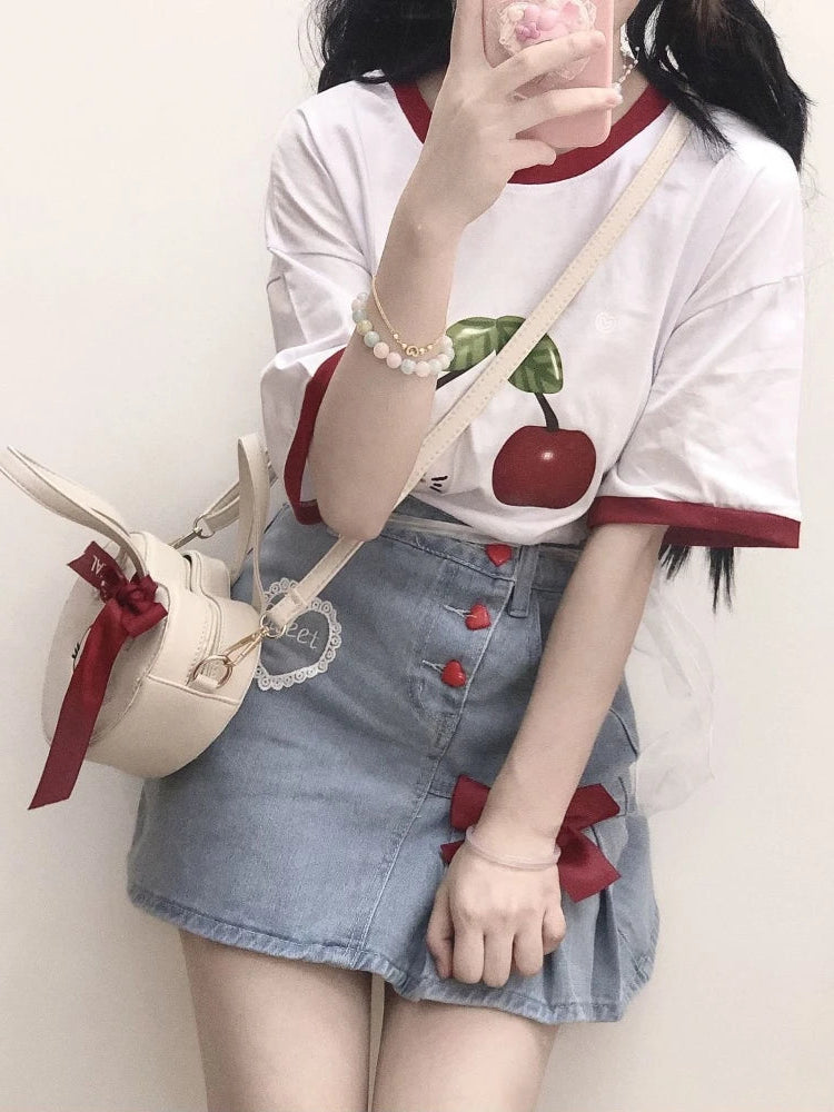 Styled with a cherry tee, the Dual Darling Denim Skirt shows off its embroidered heart patch and playful heart-shaped buttons