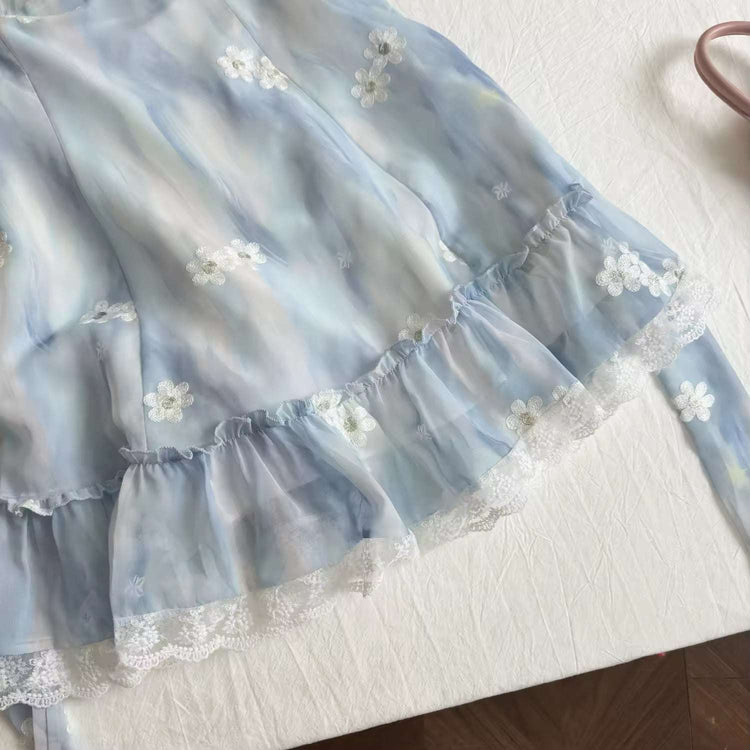 Close-up of the hemline of the midi Ethereal Flower Princess Dress, showcasing its lace trim and ruffle detailing.