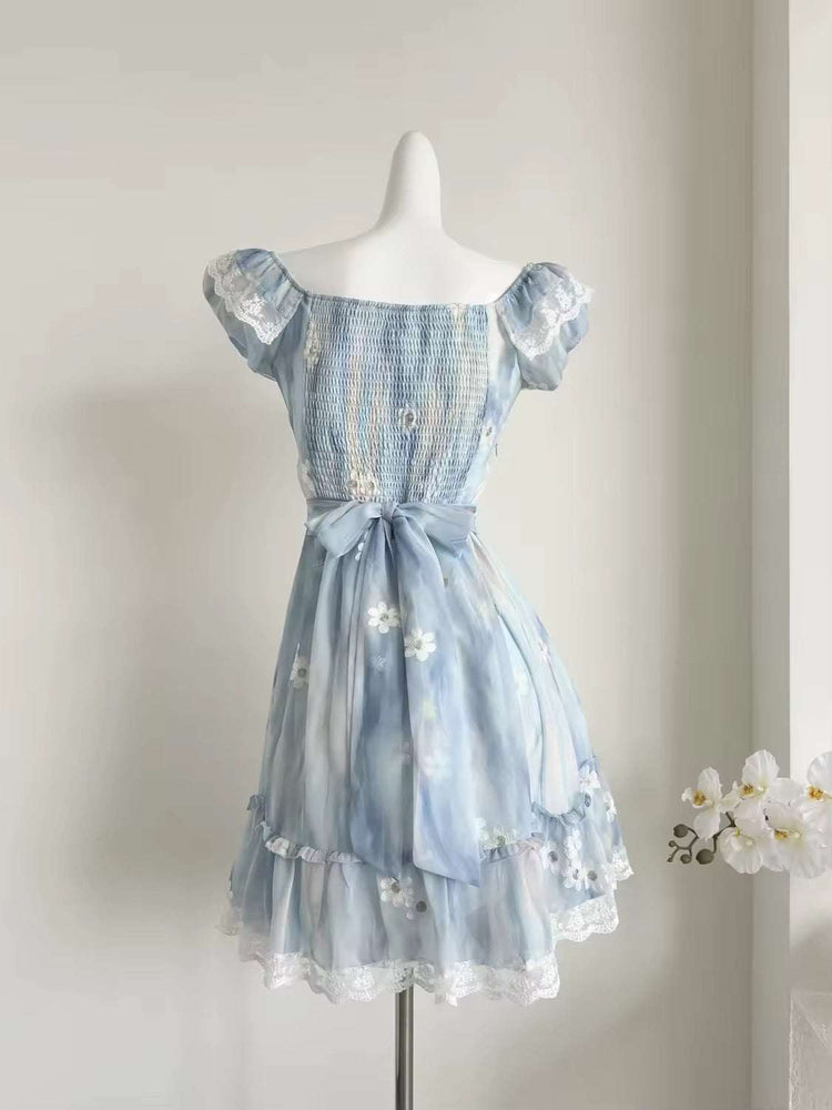 The back of the mini Ethereal Flower Princess Dress on a white mannequin.