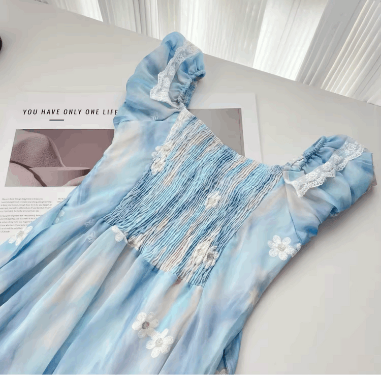 A close-up on the back of the mini Ethereal Flower Princess Dress, showcasing its scrunched detailing.