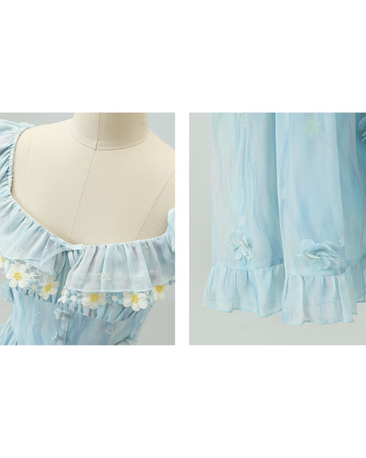 Close-up of details on the Ethereal Flower Princess Heavenly Bloom Midi Dress in light blue, like the daisy embroidered neckline and ruffled hemline.