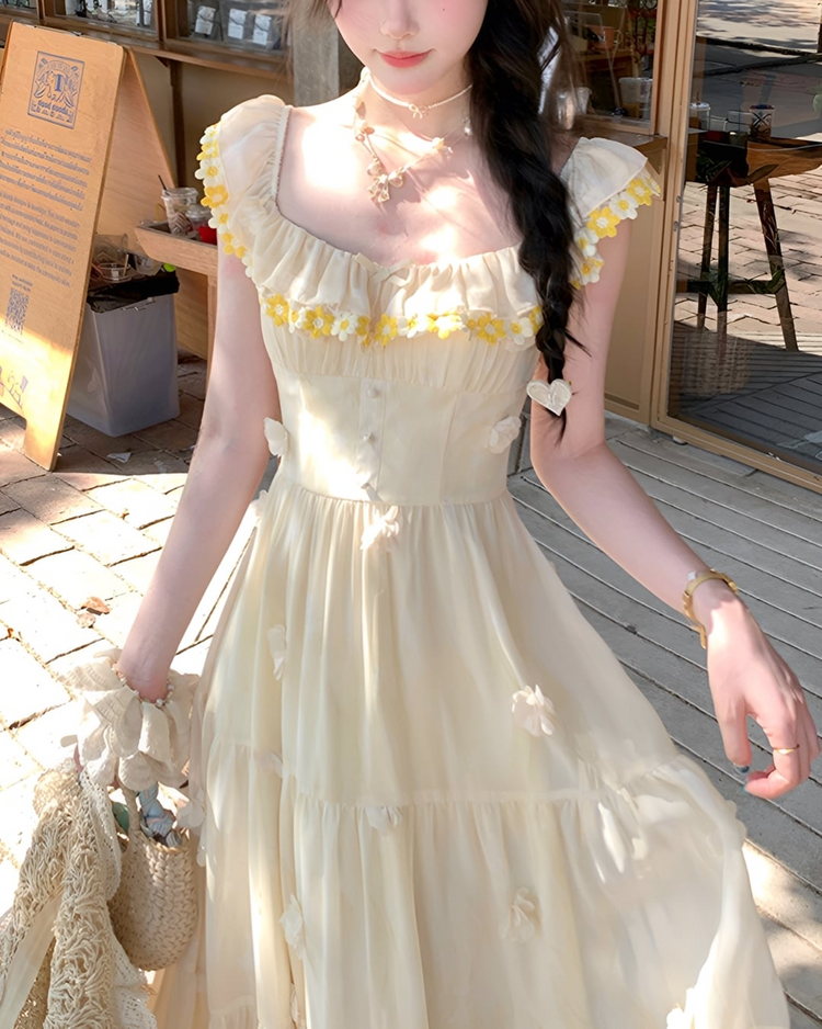 Close-up of daisy embroidery at neckline on the Ethereal Flower Princess Heavenly Bloom Midi Dress in light yellow.