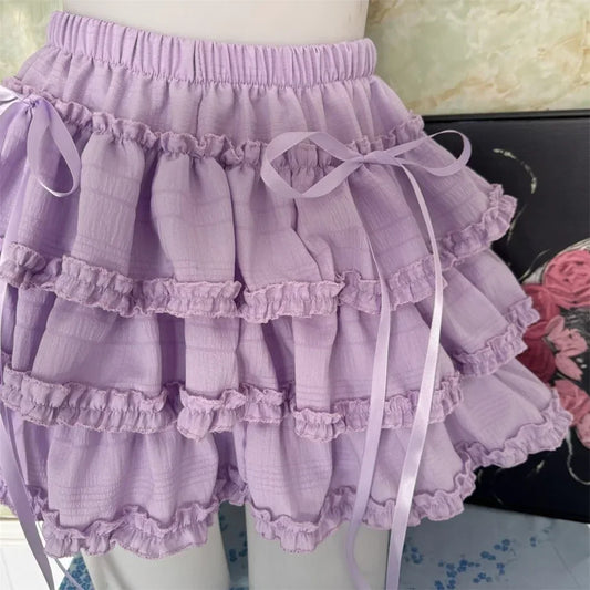 The Lavender Lullaby Skort displayed on a dress form with gathered waistband and ribbon details.