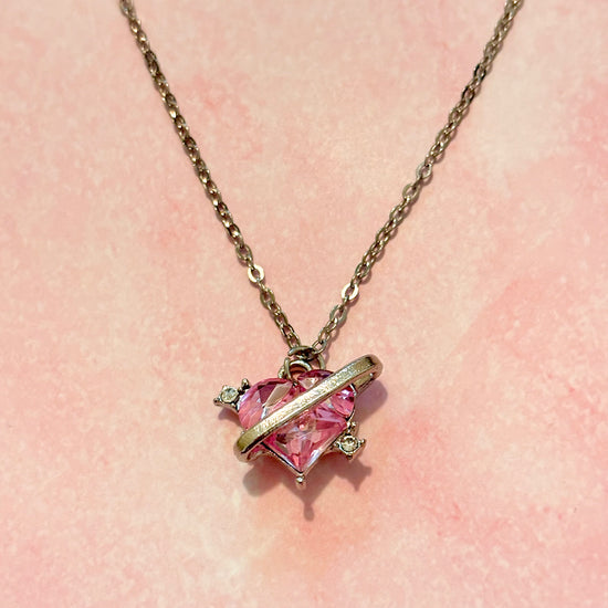 Detailed, close-up of pendant and chain on Love Orbit Necklace