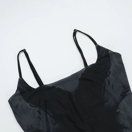 Flat lay close-up of the bust area of the Midnight Butterfly Maxi Dress, showing neckline and stitching.