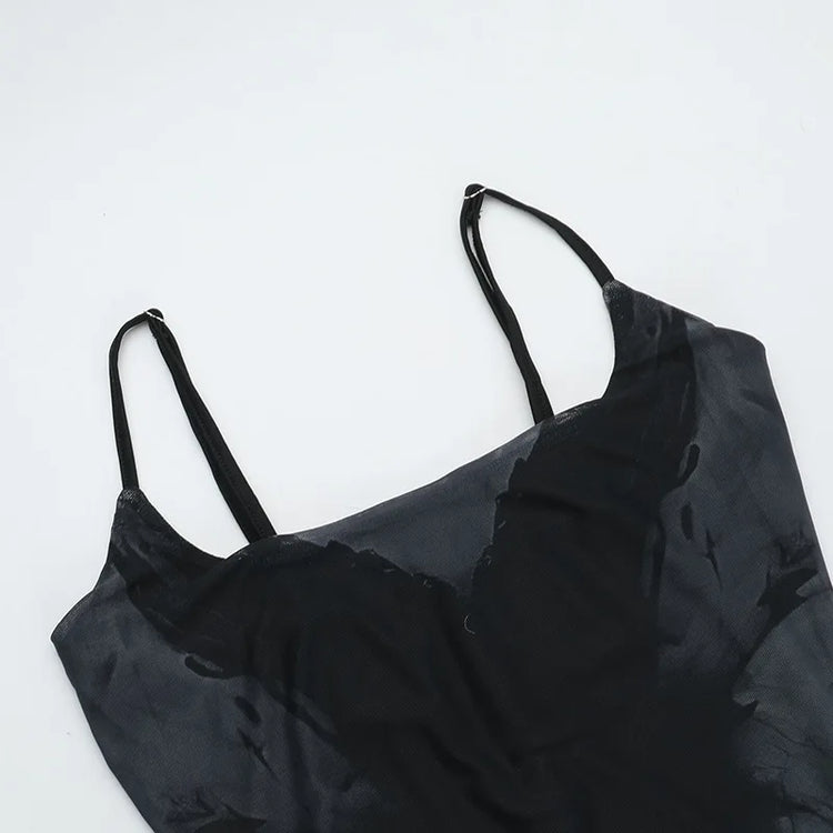 Flat lay close-up of the bust area of the Midnight Butterfly Maxi Dress, showing neckline and stitching.
