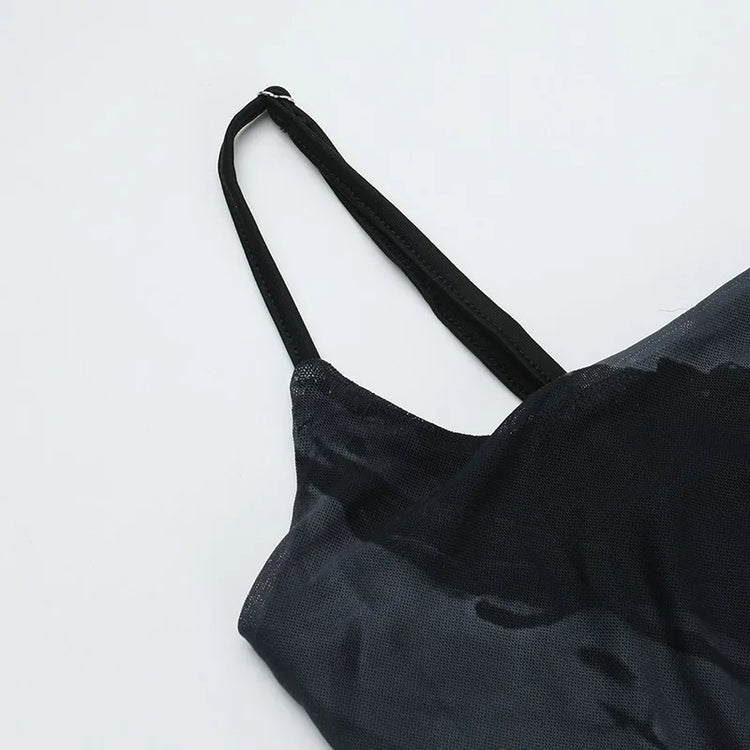 Close-up flat lay of the Midnight Butterfly Maxi Dress showing straps and upper section.