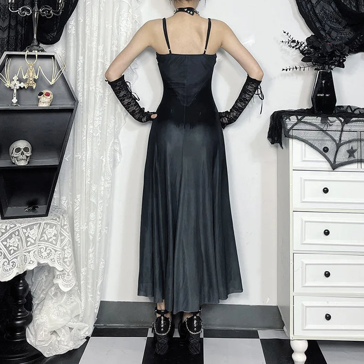 Model showing the back of the Midnight Butterfly Maxi Dress with hands on hips to reveal straps and back details.