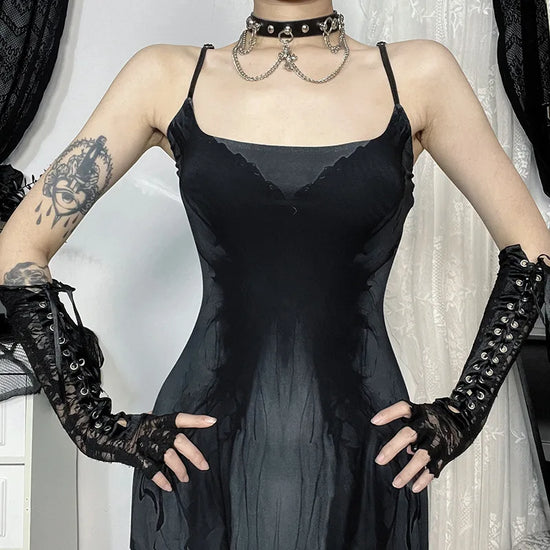 Close-up of model wearing the Midnight Butterfly Maxi Dress showing neckline, straps, and butterfly print detail.
