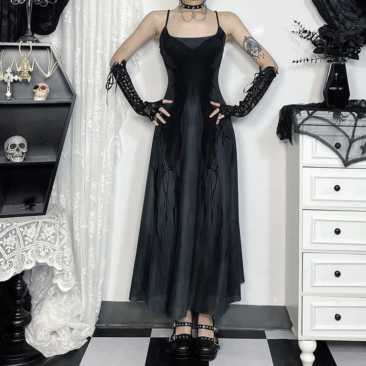 Model with hands on hips in the Midnight Butterfly Maxi Dress to display its flared fit.