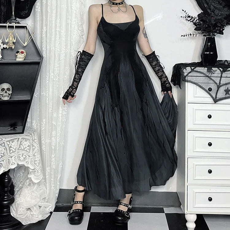 Model gently flaring out the skirt of the Midnight Butterfly Maxi Dress to display its flow and length.