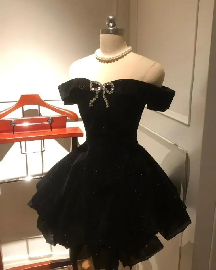 Angled front view of the Midnight Gala Bow Dress showing the sparkly velvet and sculpted bodice.