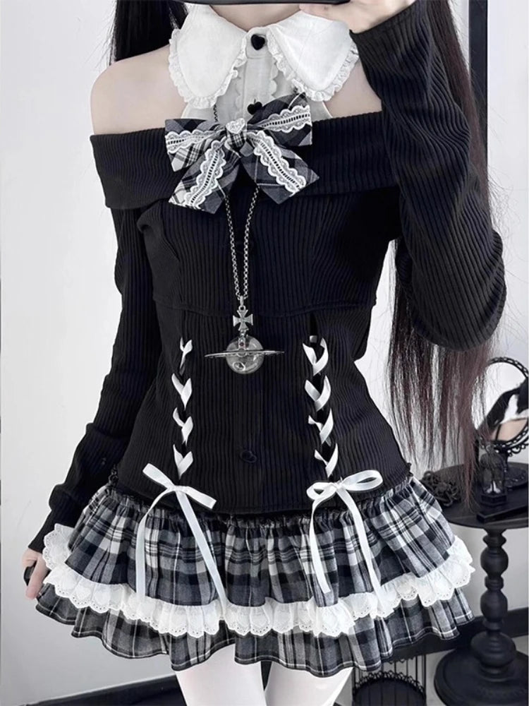 Close-up of the Midnight Manor Skort Set highlighting the faux two-piece sweater, corset-inspired lace-up front, black heart-shaped buttons, bow accents, and statement bow.
