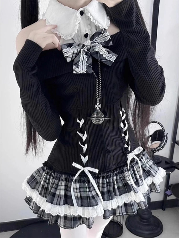 Three-quarter view of the model wearing the Midnight Manor Skort Set featuring the halter off-the-shoulder sweater and layered plaid skort.