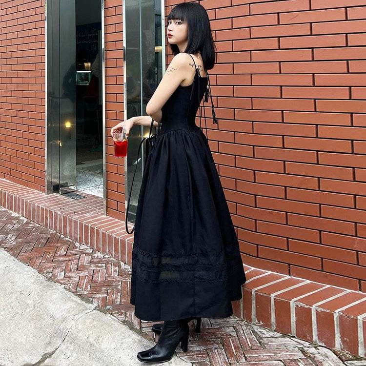 Side view of the Midnight Sonata Corset Dress, showing the fitted bodice and maxi-length flow.
