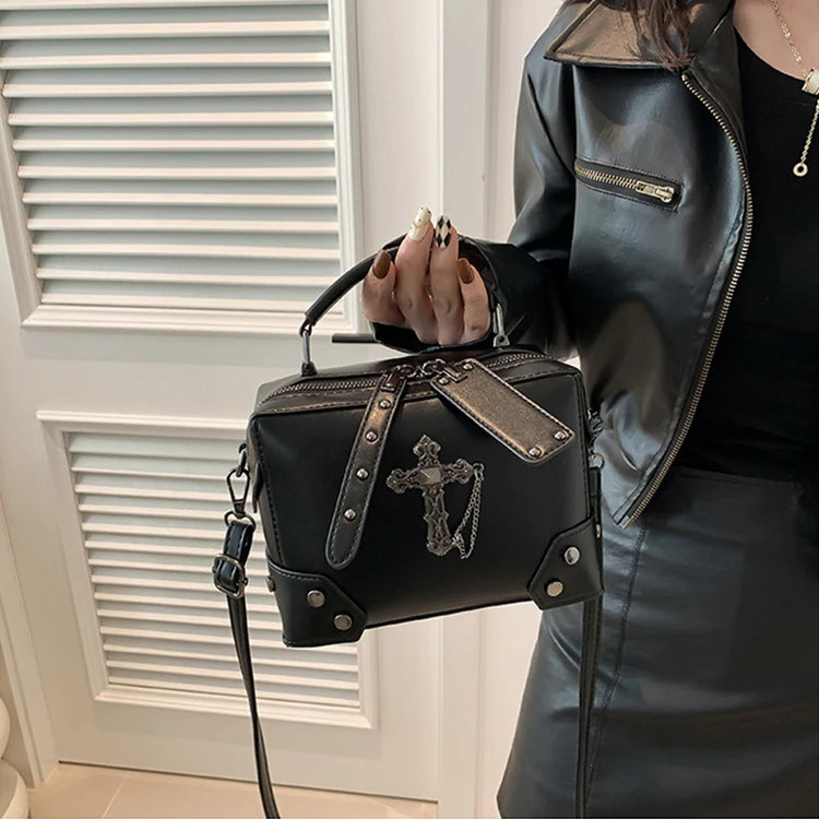 The cross version of the Moonlit Mourning Crossbody carried by the top handle.