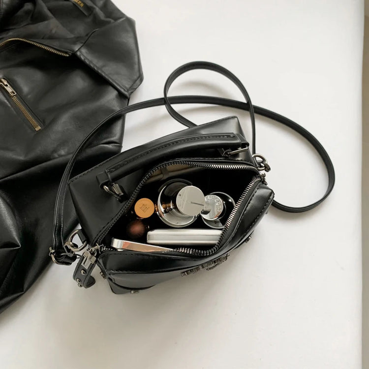 Open view of the Moonlit Mourning Crossbody showing the interior compartment.
