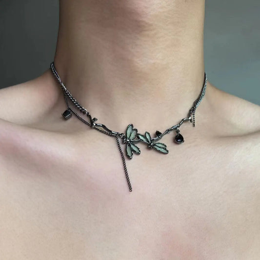 The Moonvine Dragonfly Necklace worn as a dark romantic choker with dragonfly-inspired details and smoky silver chains.