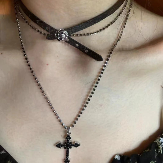 Model wearing both the rose choker and layered cross together.