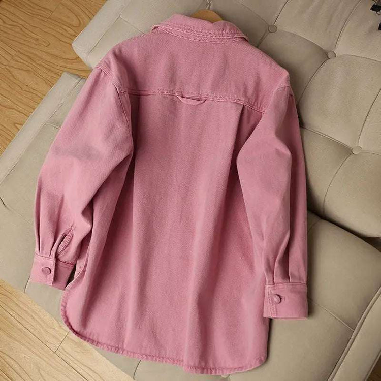 Back view of the Pink Petal Denim Overshirt, highlighting the oversized silhouette and curved hem.