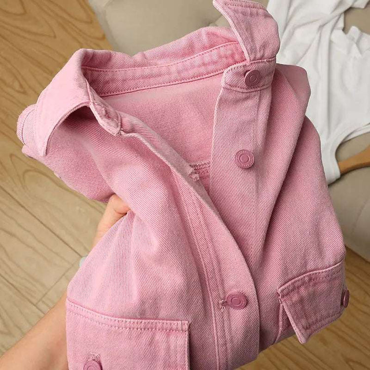 Close-up of the Pink Petal Denim Overshirt, highlighting the soft pink denim fabric, turn-down collar, and matching buttons.