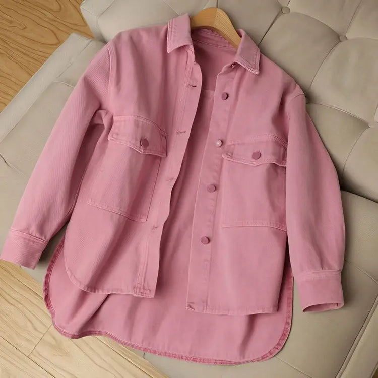 Front view of the Pink Petal Denim Overshirt featuring a soft pink denim finish, button-up front, chest pockets, and oversized fit.
