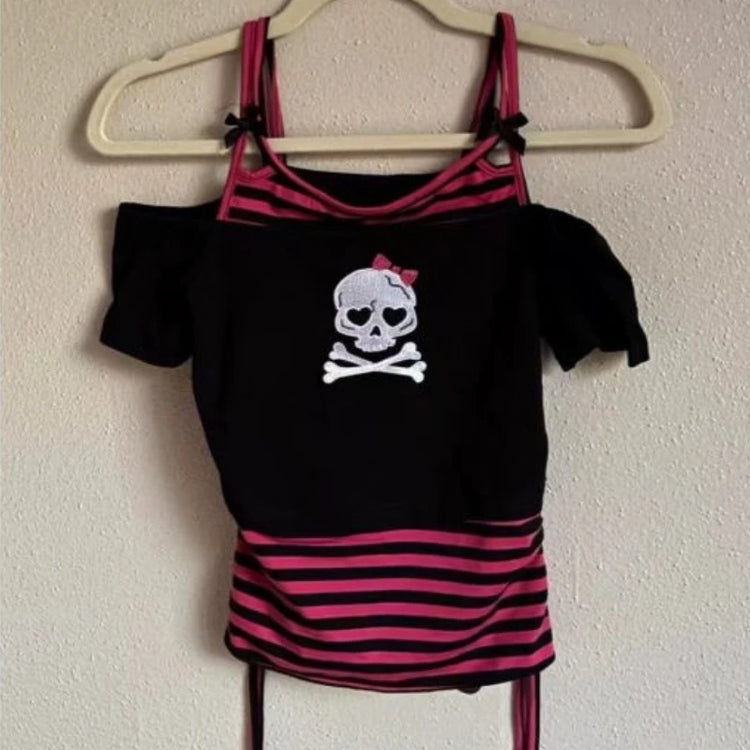 Pink Riot Skull Top featuring an off-shoulder square neckline, skull graphic front, and black and hot pink striped faux cami layered detail.