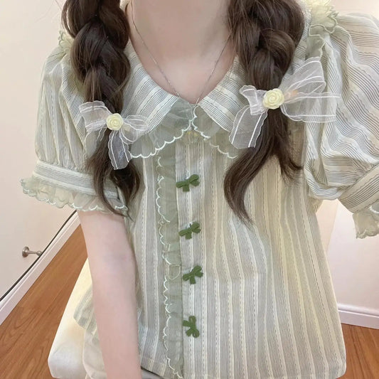 Close-up view of Pistachio Ribbon Striped Blouse showing puff sleeves, collar, and lace trim