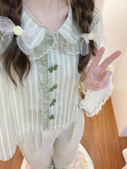 Pistachio Ribbon Striped Blouse with braided hairstyle and floral bow hair clips