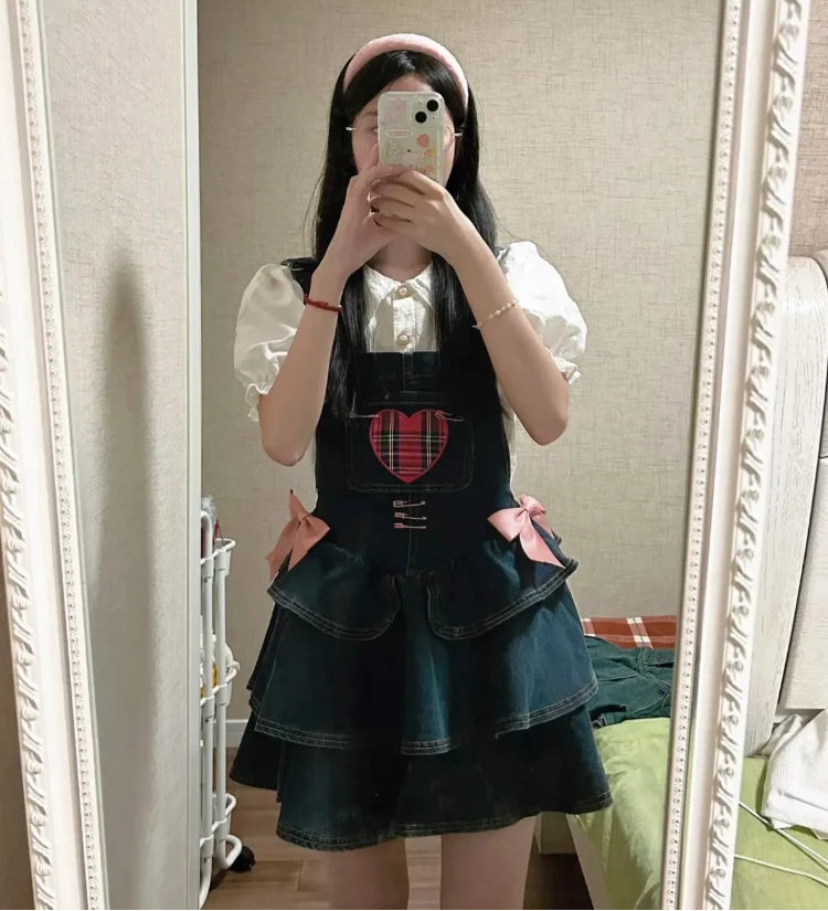 Pocket Full of Love Overall Dress worn over a white ruffle blouse in a mirror selfie