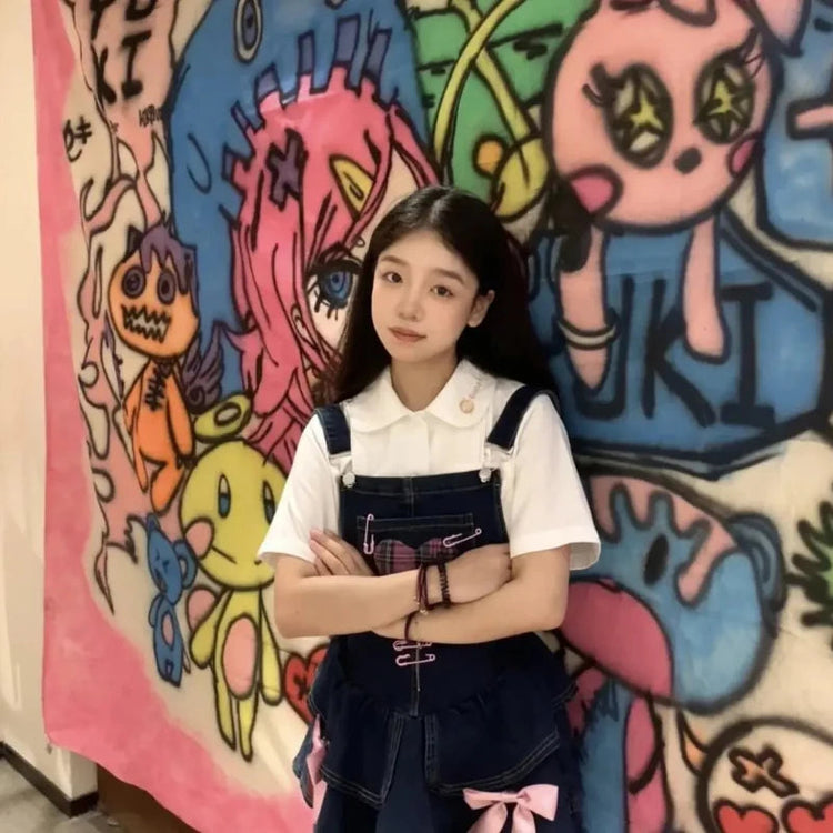Pocket Full of Love Overall Dress layered with a white collared shirt, front pose