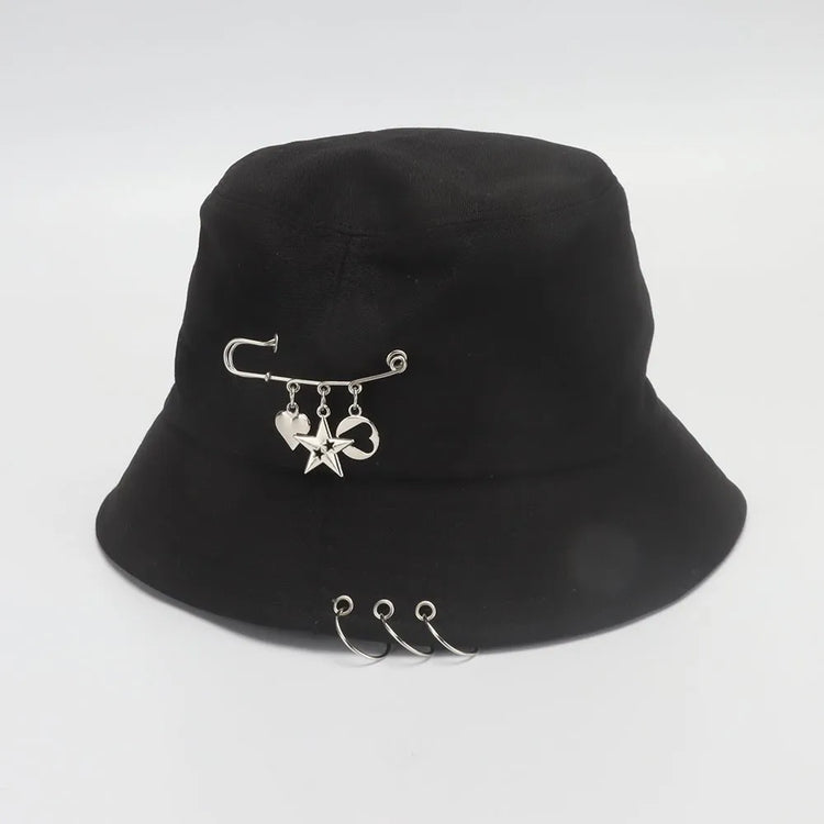 Angled view of the Rebel Charm Bucket Hat in black highlighting the charm details and structured shape.
